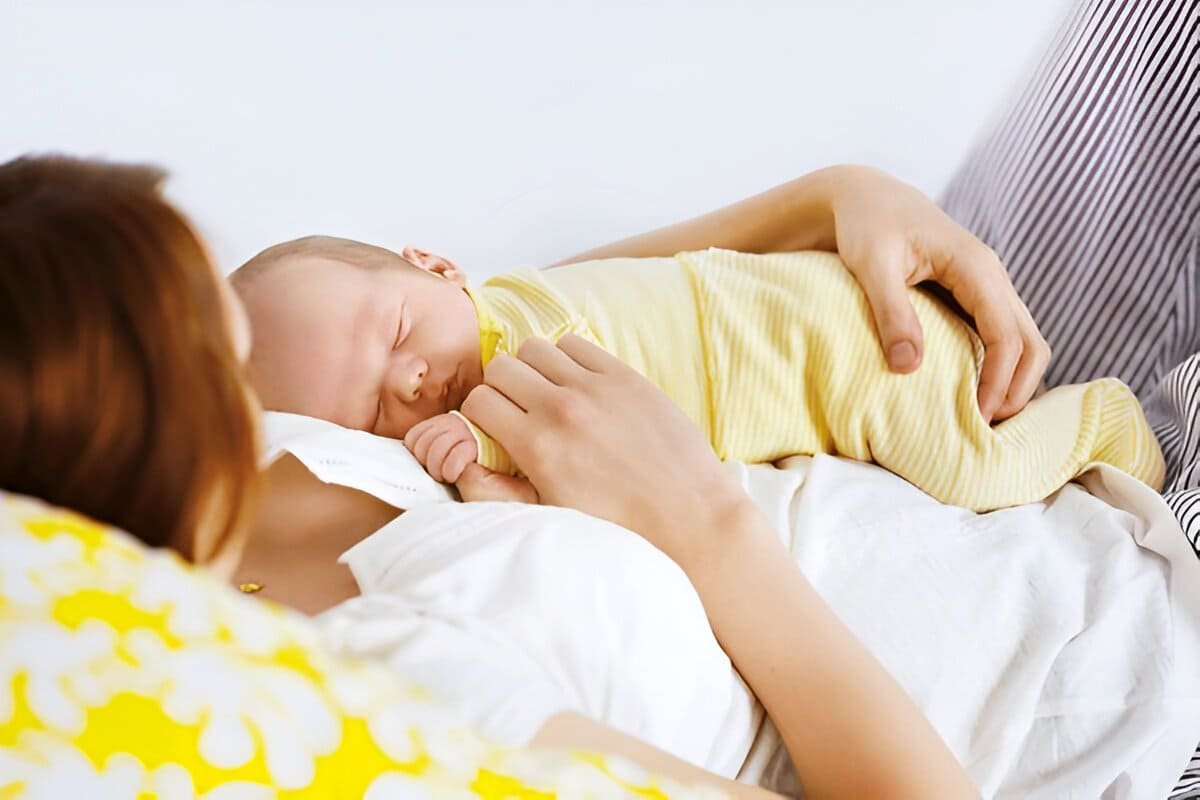 mother resting with newborn